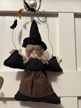 Stuffed black witch with wire hanger, 14" from hanger to hem